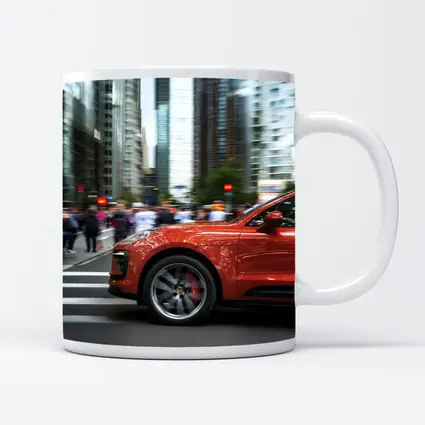 Porsche Macan Orange Speeding Through City Streets