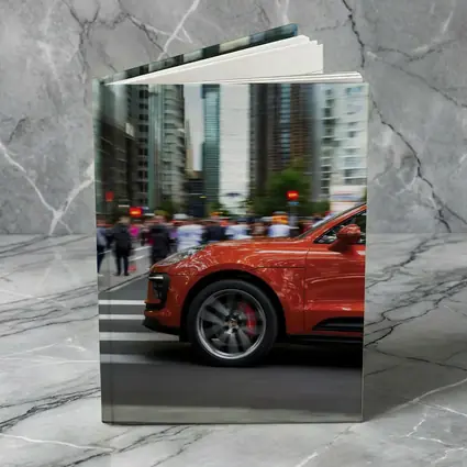 Porsche Macan Orange Speeding Through City Streets