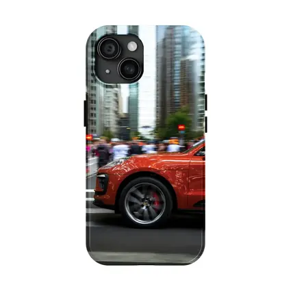 Porsche Macan Orange Speeding Through City Streets