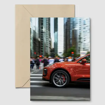 Porsche Macan Orange Speeding Through City Streets