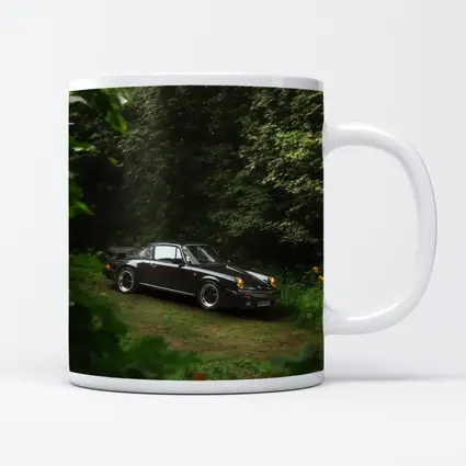 Black Porsche 911 Parked in Green Forest