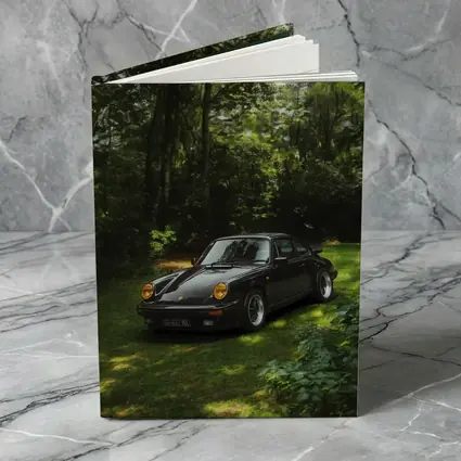 Black Porsche 911 Parked in Green Forest