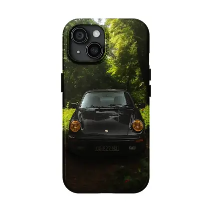 Black Porsche 911 Parked in Green Forest