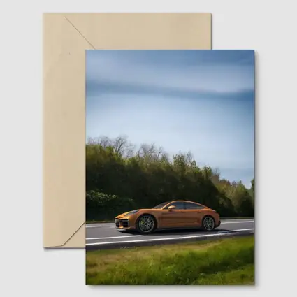 Porsche Panamera Orange on Open Road