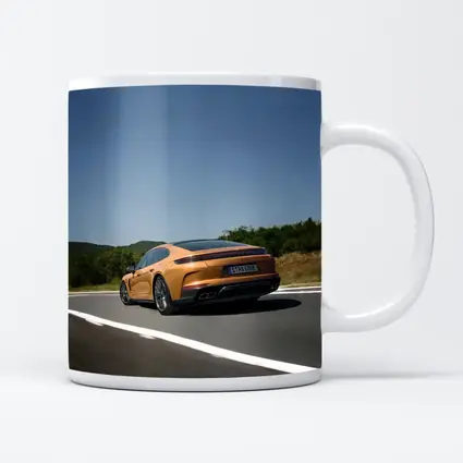 Porsche Panamera Orange On Open Road
