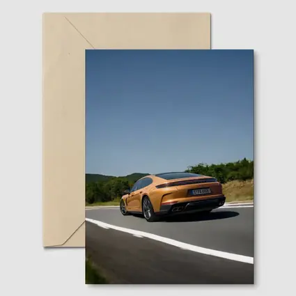 Porsche Panamera Orange On Open Road