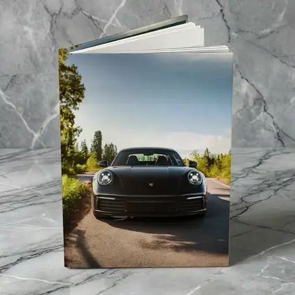 Black Porsche 911 On Tree Lined Road