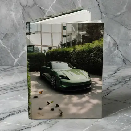 Green Porsche Taycan Parked Near Glass Building