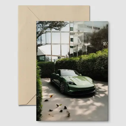 Green Porsche Taycan Parked Near Glass Building