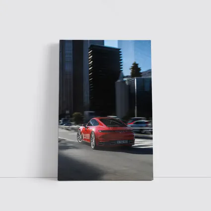 Red Porsche 911 Driving Through City Streets