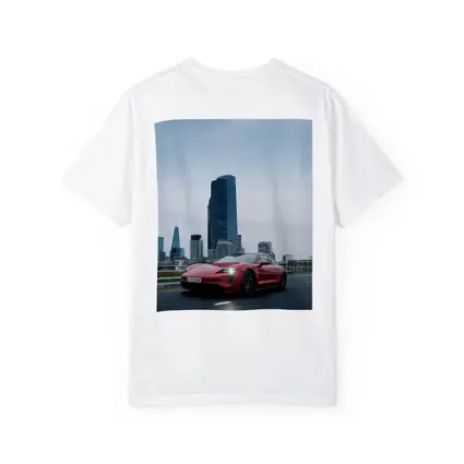 Red Porsche Taycan Driving Through City Skyline
