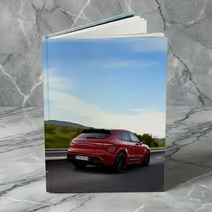 Red Porsche Cayenne Speeding On Open Road