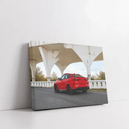Red BMW X6M Under Concrete Bridge
