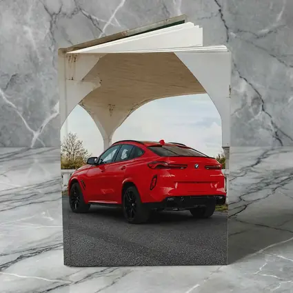 Red BMW X6M Under Concrete Bridge