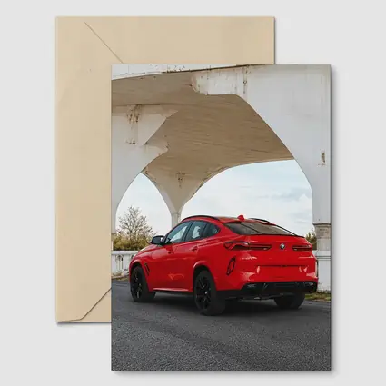 Red BMW X6M Under Concrete Bridge