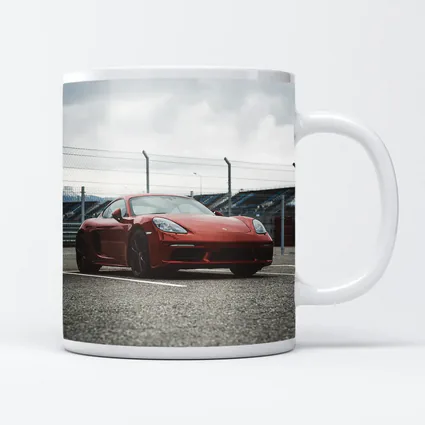 Red Porsche Cayman at Racing Circuit Track
