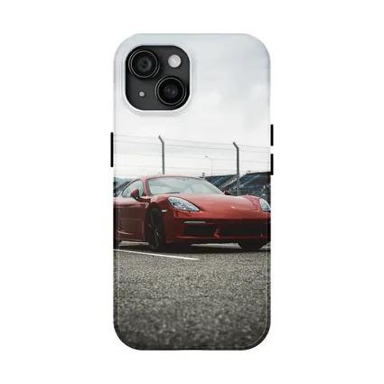 Red Porsche Cayman at Racing Circuit Track