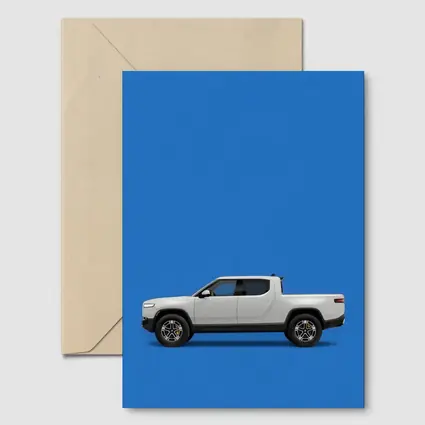 Rivian R1T White Truck Blue Background