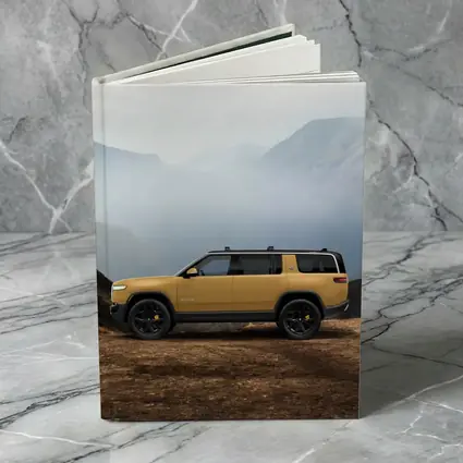 Rivian R1S Yellow SUV Mountain Landscape