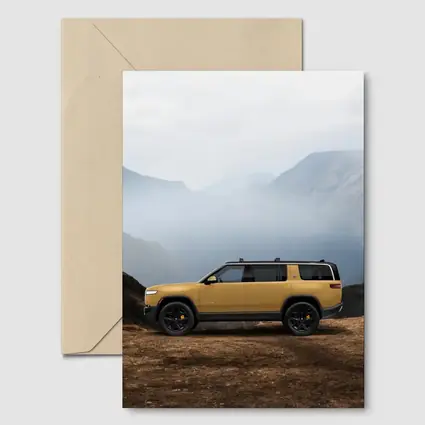 Rivian R1S Yellow SUV Mountain Landscape