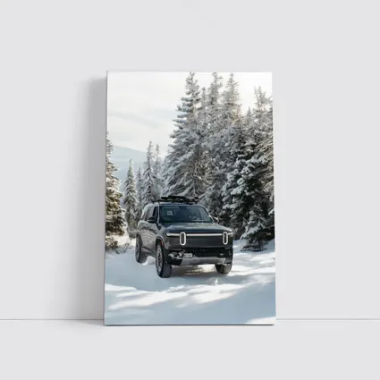 Rivian R1S Dark SUV Snowy Forest Trail
