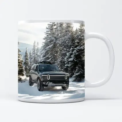 Rivian R1S Dark SUV Snowy Forest Trail