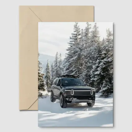 Rivian R1S Dark SUV Snowy Forest Trail
