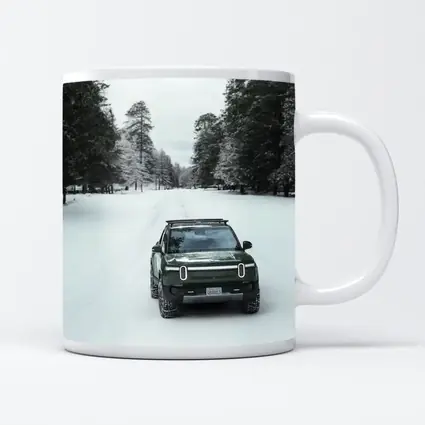 Rivian R1S Green Truck Snowy Forest Road