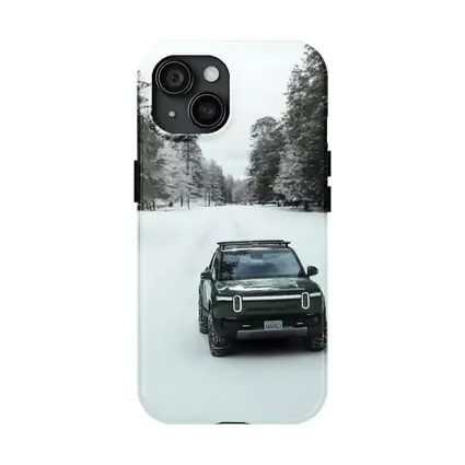 Rivian R1S Green Truck Snowy Forest Road