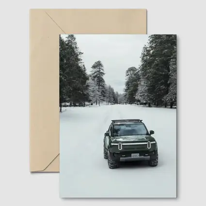 Rivian R1S Green Truck Snowy Forest Road