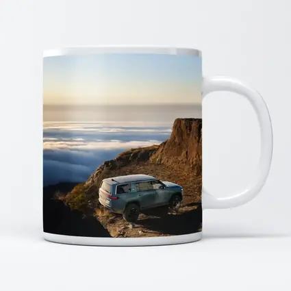 Rivian R1S SUV Above Mountain Clouds