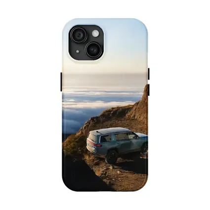 Rivian R1S SUV Above Mountain Clouds