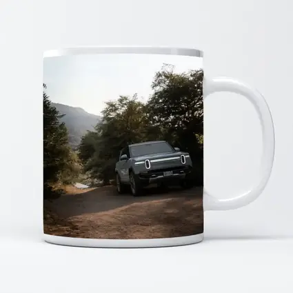 Rivian R1T Electric Truck Dirt Road Forest