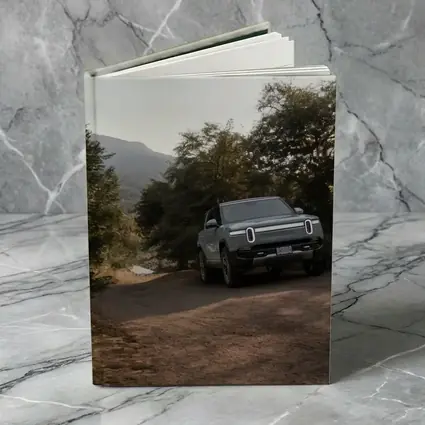 Rivian R1T Electric Truck Dirt Road Forest