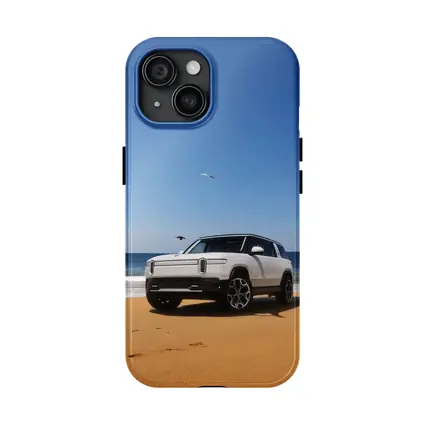 Rivian R1S White SUV Beach Ocean