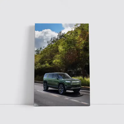 Rivian R1S Green SUV Forest Road Drive