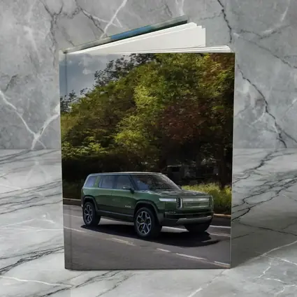 Rivian R1S Green SUV Forest Road Drive