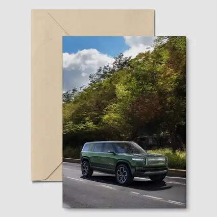 Rivian R1S Green SUV Forest Road Drive