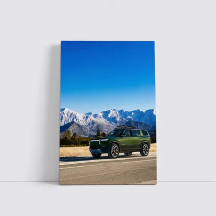 Rivian R1S Green SUV Snowy Mountains