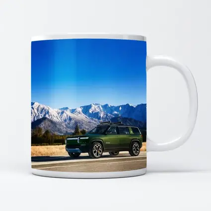 Rivian R1S Green SUV Snowy Mountains