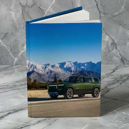 Rivian R1S Green SUV Snowy Mountains