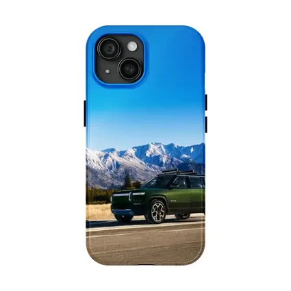Rivian R1S Green SUV Snowy Mountains
