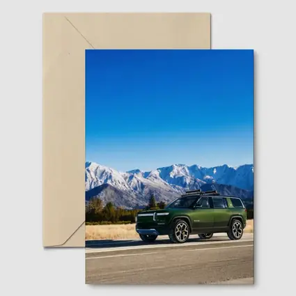 Rivian R1S Green SUV Snowy Mountains