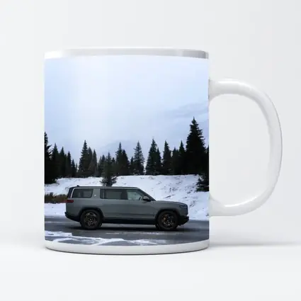 Rivian R1S Gray SUV Snowy Mountain Forest
