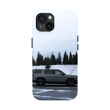 Rivian R1S Gray SUV Snowy Mountain Forest