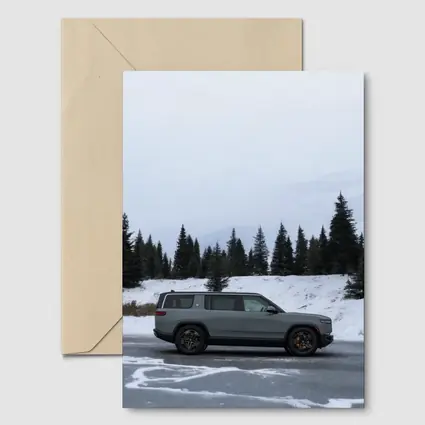 Rivian R1S Gray SUV Snowy Mountain Forest