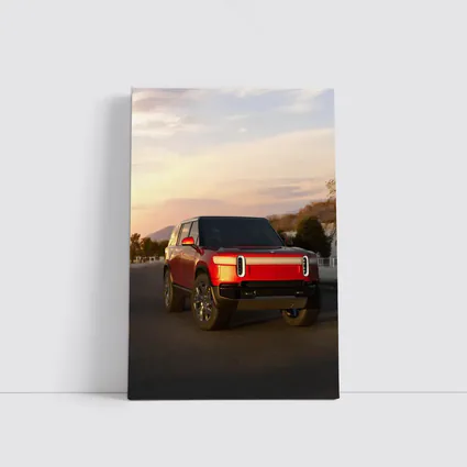 Rivian R1S Red SUV Sunset Sky