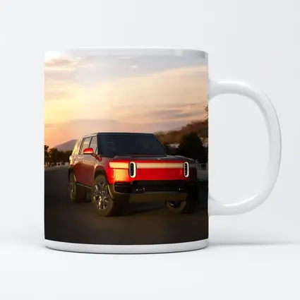 Rivian R1S Red SUV Sunset Sky
