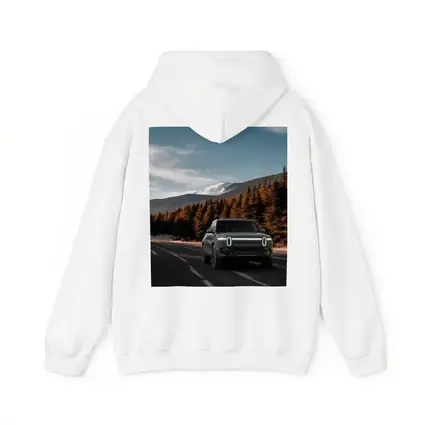 Rivian R1S on Mountain Road Forest Background