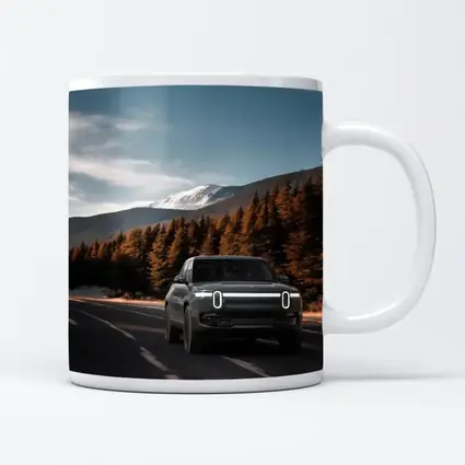 Rivian R1S on Mountain Road Forest Background